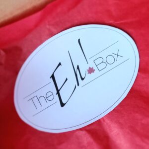 White oval label on red background.
