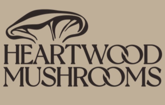 Heartwood Mushrooms logo with mushroom illustration.